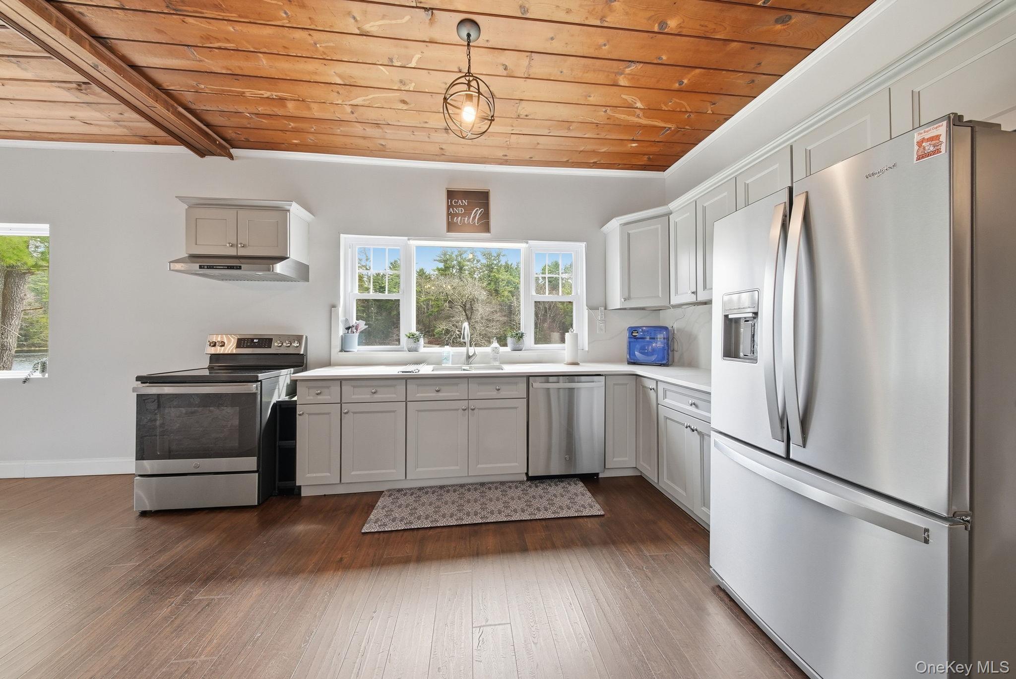 10 Stag Forest Road Forestburgh, NY 12777 - Photo 14 of 44 a kitchen with a refrigerator and a stove top oven