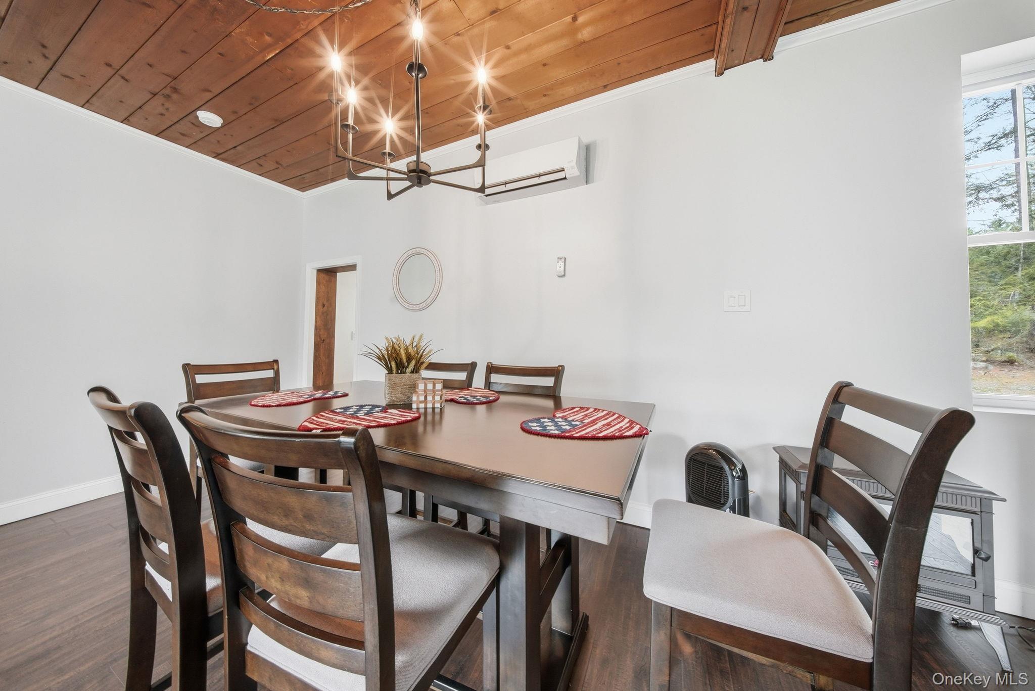 10 Stag Forest Road Forestburgh, NY 12777 - Photo 15 of 44 a view of a dining room that has a table and chairs in it