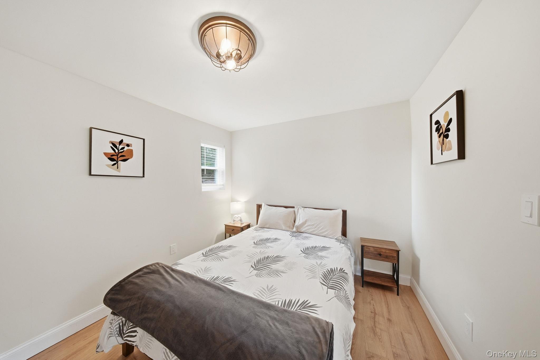 10 Stag Forest Road Forestburgh, NY 12777 - Photo 16 of 44 a bedroom with a bed and a table