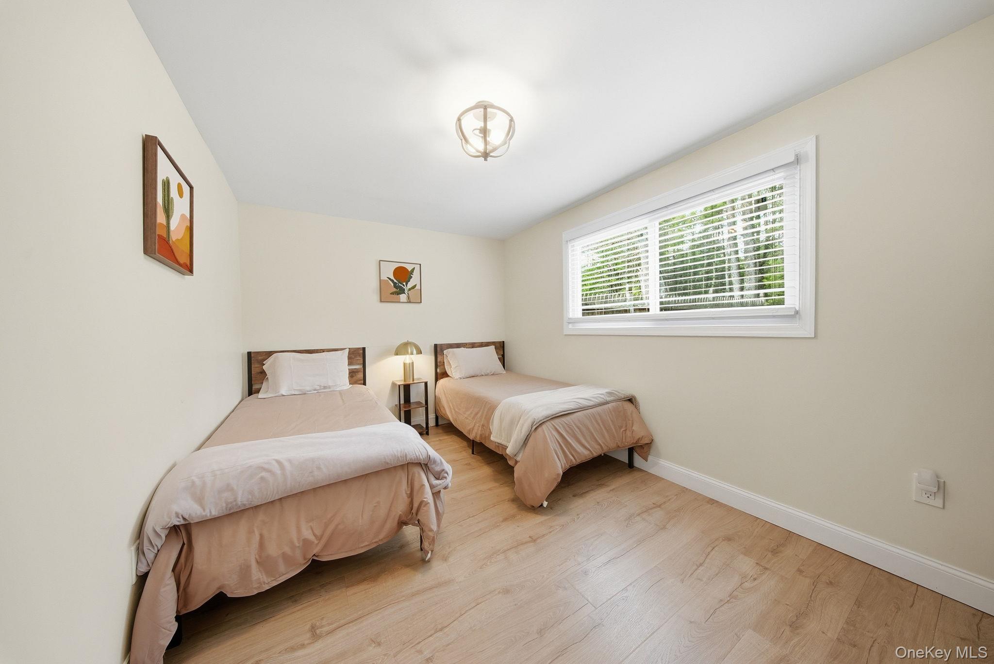 10 Stag Forest Road Forestburgh, NY 12777 - Photo 19 of 44 a bedroom with two beds and a window