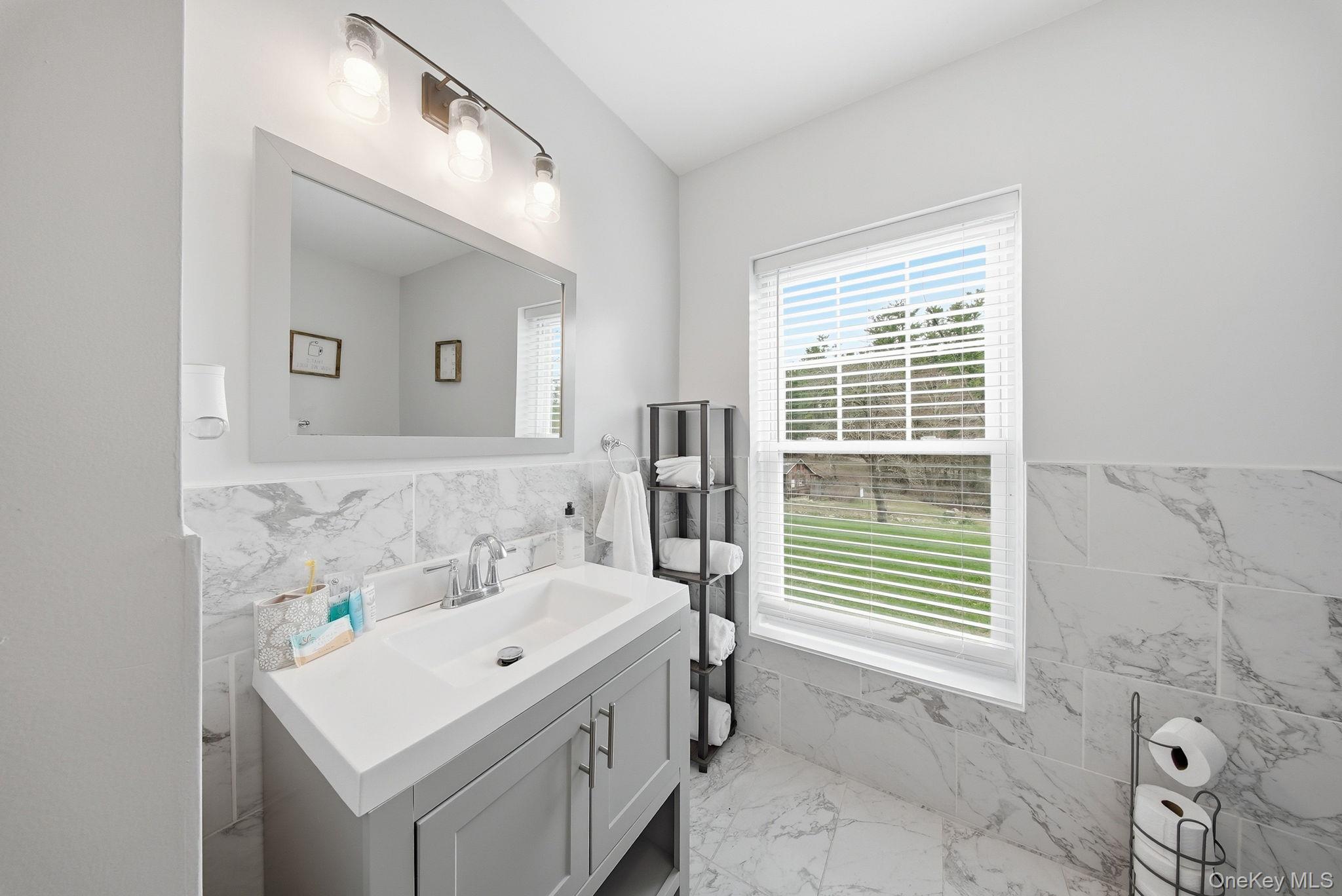 10 Stag Forest Road Forestburgh, NY 12777 - Photo 21 of 44 a bathroom with a sink a vanity and a mirror