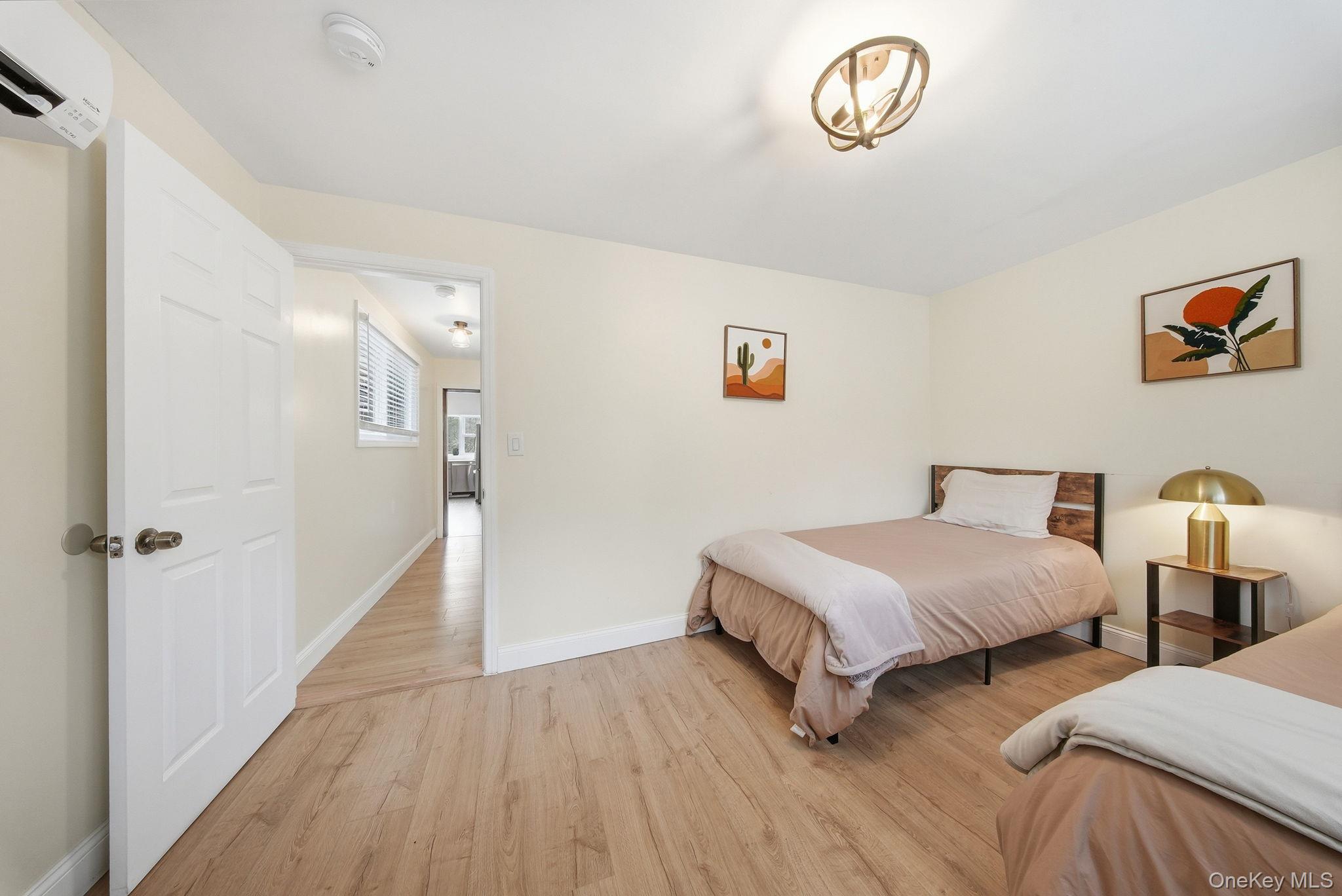 10 Stag Forest Road Forestburgh, NY 12777 - Photo 23 of 44 a bedroom with two beds and a table