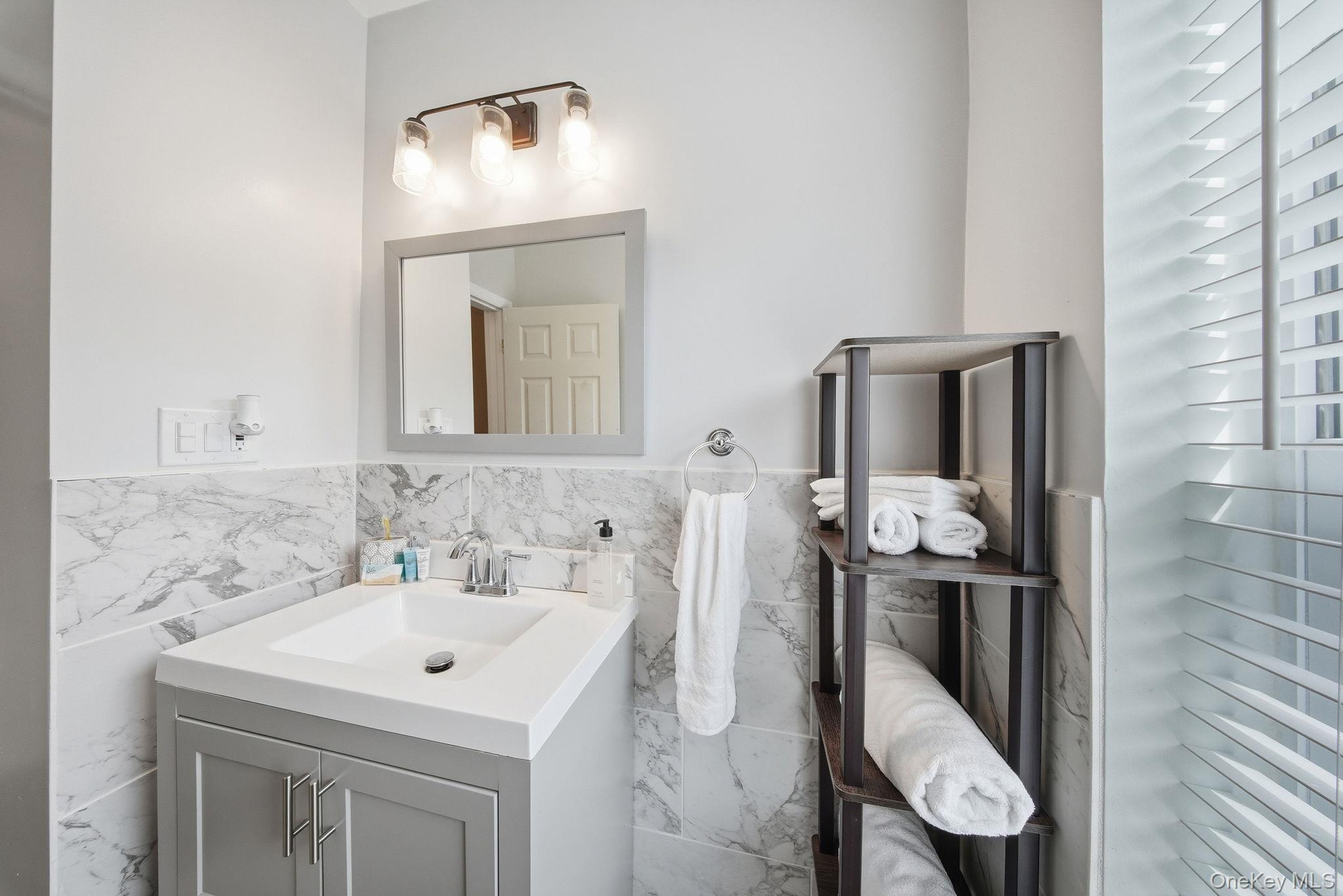 10 Stag Forest Road Forestburgh, NY 12777 - Photo 24 of 44 a bathroom with a sink a toilet and mirror