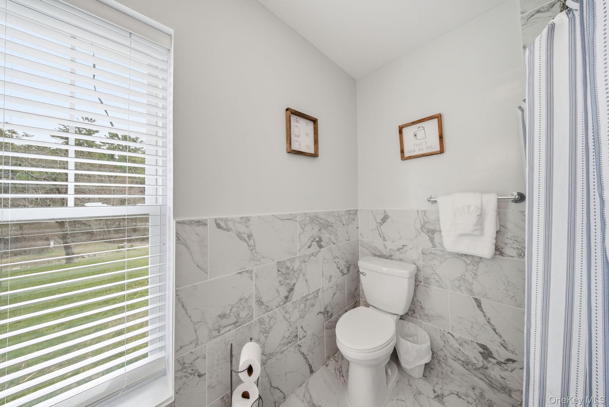 10 Stag Forest Road Forestburgh, NY 12777 - Photo 25 of 44 a white toilet sitting next to a bathroom sink