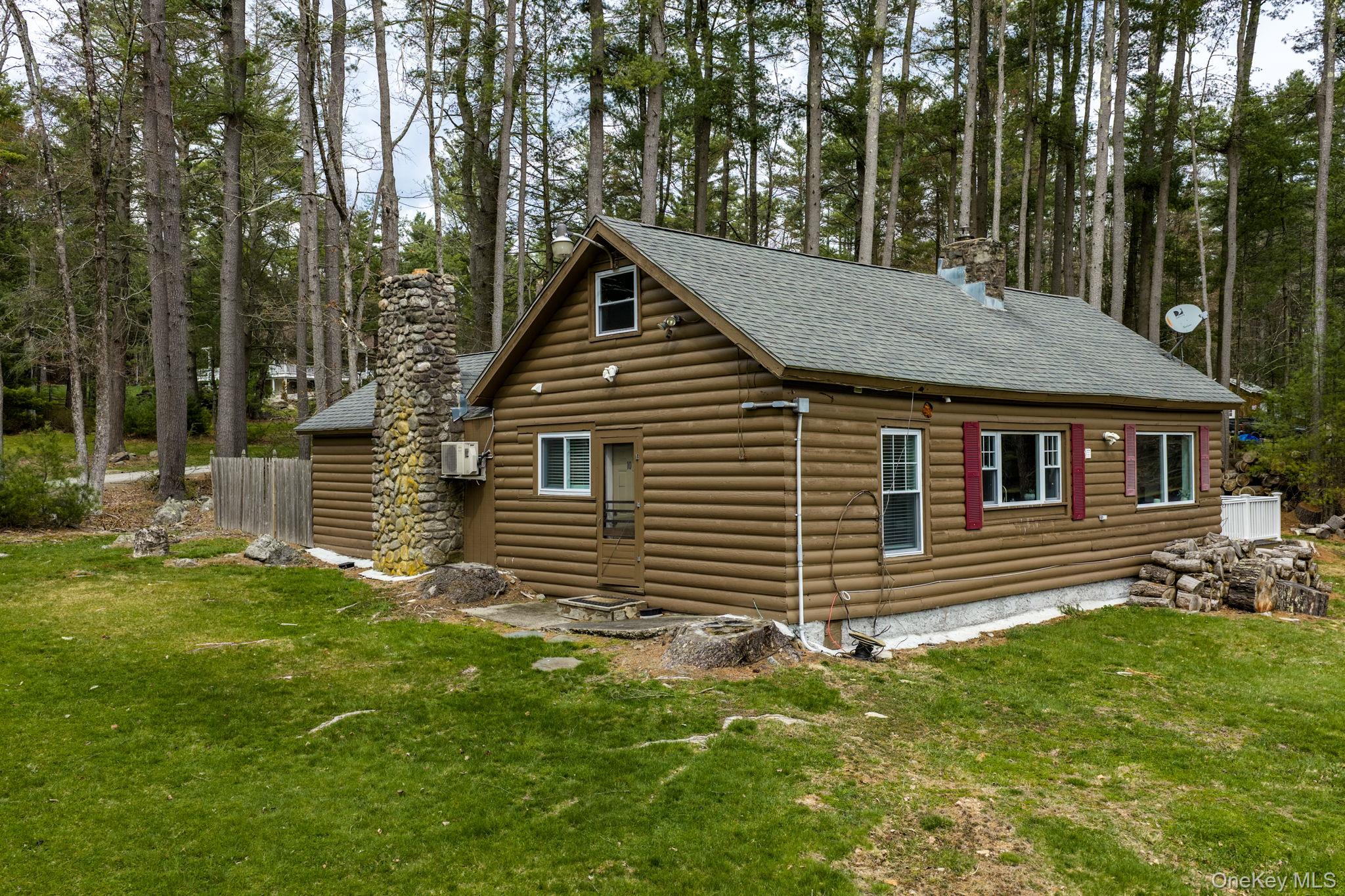 10 Stag Forest Road Forestburgh, NY 12777 - Photo 26 of 44 a backyard of a house with seating space