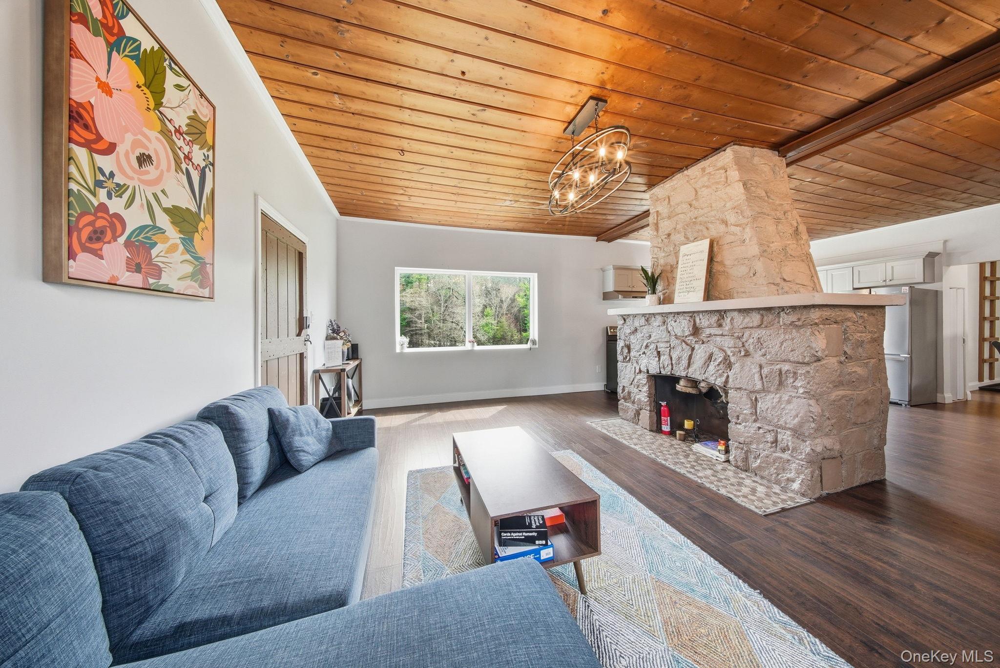 10 Stag Forest Road Forestburgh, NY 12777 - Photo 8 of 44 a living room with furniture and a fireplace