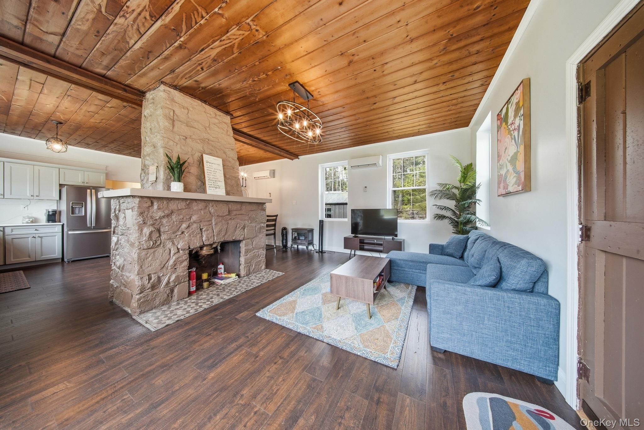 10 Stag Forest Road Forestburgh, NY 12777 - Photo 9 of 44 a living room with furniture and a fireplace