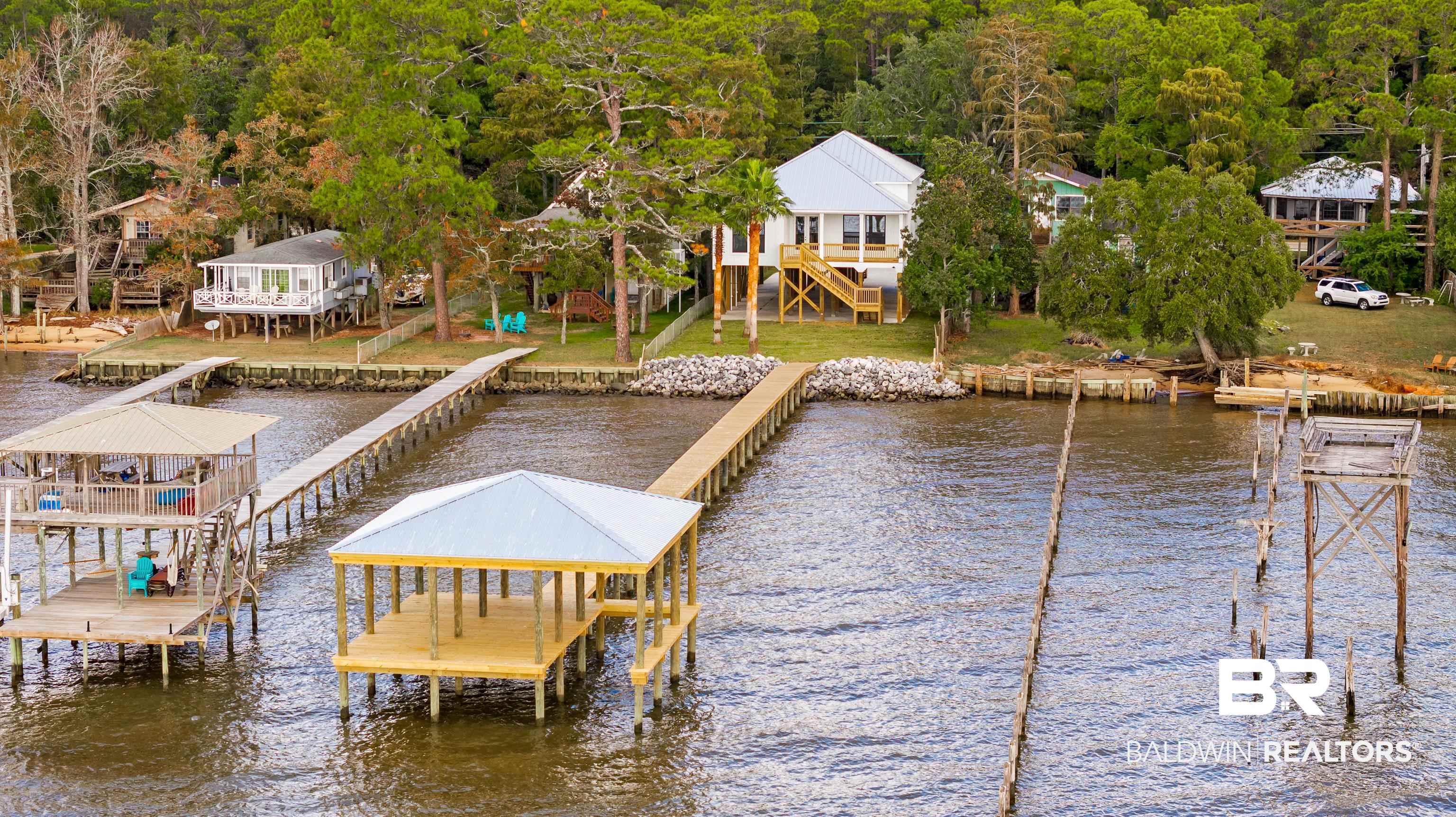 12453 County Road 1 Fairhope, AL 36532 - Photo 31 of 33 View of dock featuring a yard and a water view