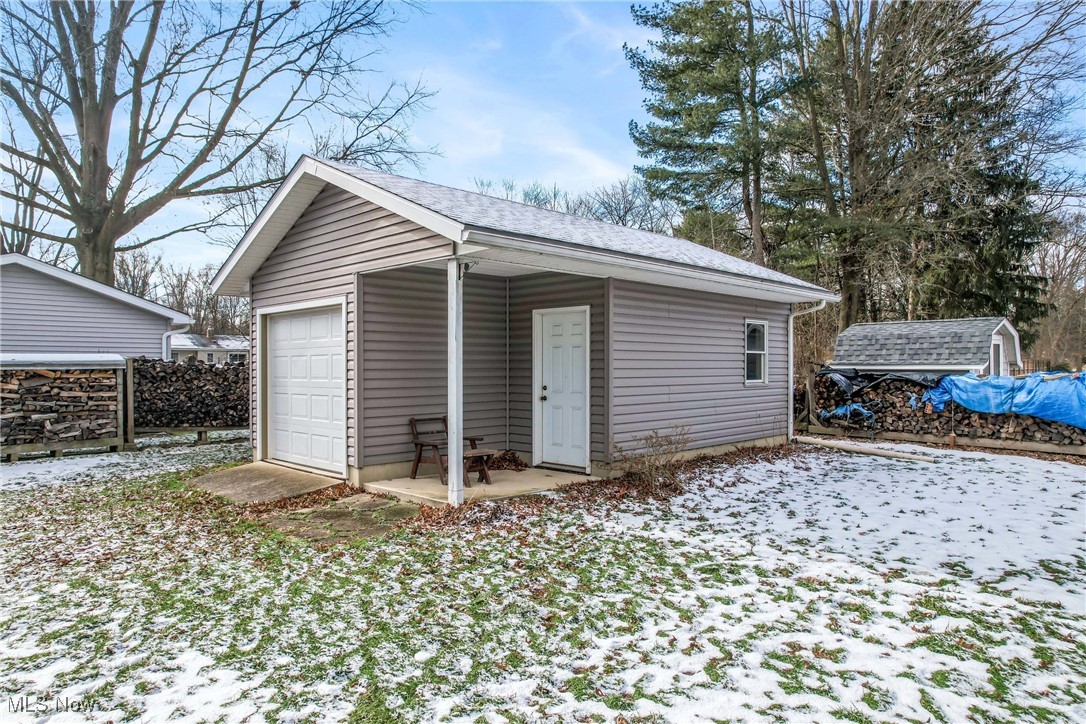 3210 Oser Road Norton, OH 44203 - Photo 10 of 47 Snow covered structure with a garage