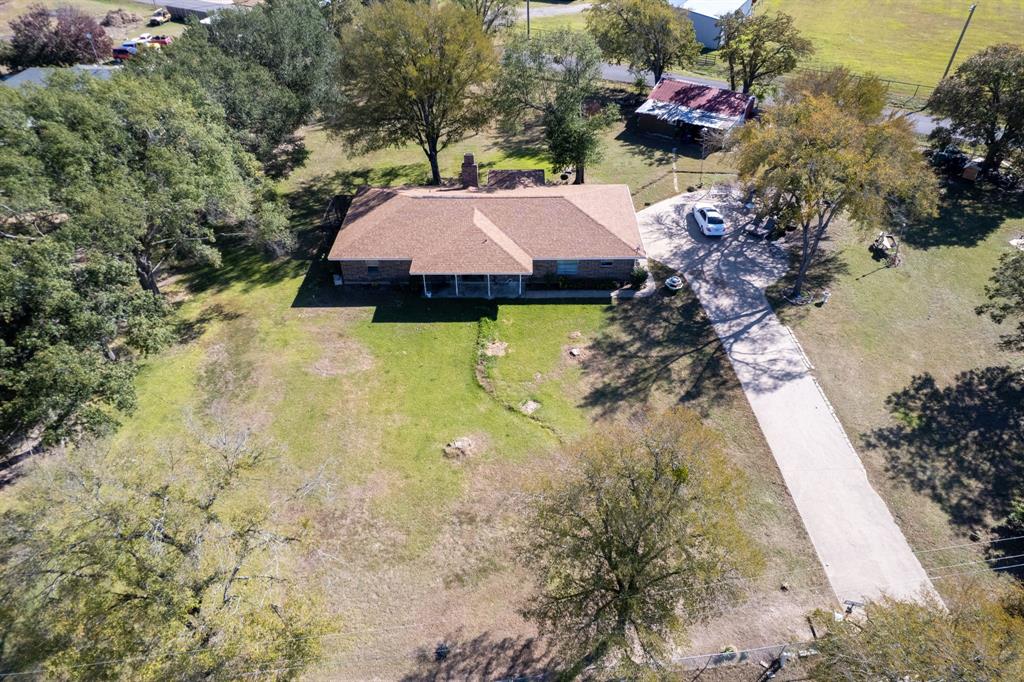 12475 Fm 2728 Terrell, TX 75161 - Photo 25 of 27 a aerial view of a house with swimming pool and large trees