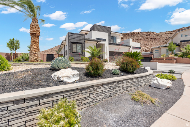 6105 Bunda Way St. George, UT 84790 - Photo 48 of 49 Contemporary exterior featuring light stucco and dark horizontal siding