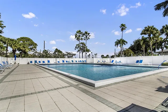 a view of outdoor space with swimming pool and lounge chair