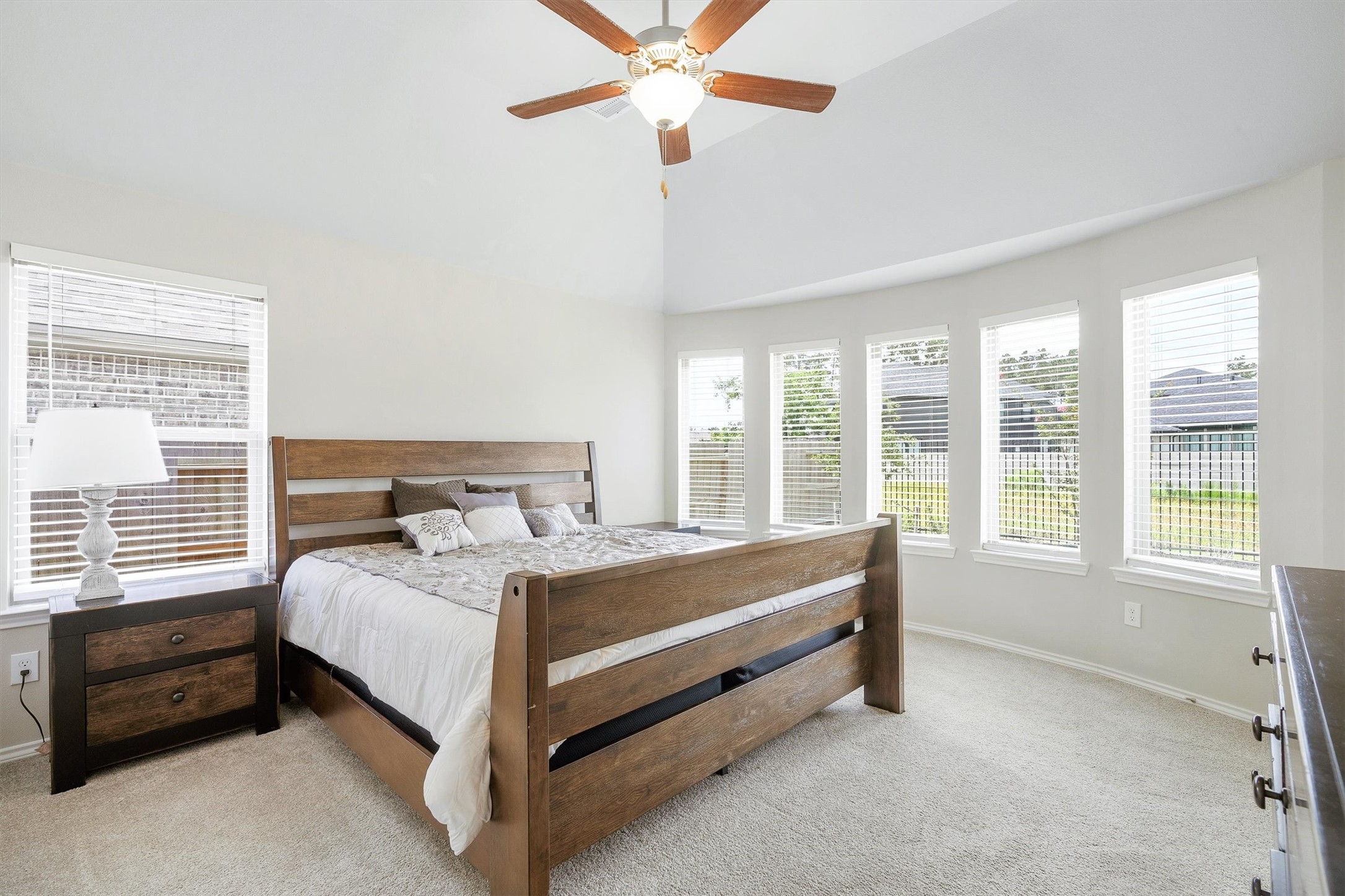 17270 Wild Watermelon Way Conroe, TX 77302 - Photo 13 of 28 That window wall though. The primary bedroom wraps you in natural light from a beautiful bank of windows. This room wakes you up happy.