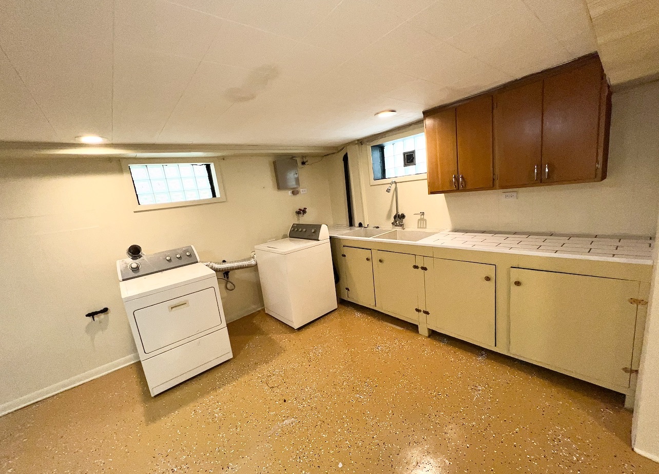 12351 South Union Avenue Chicago, IL 60628 - Photo 11 of 16 a view of a kitchen with sink cabinets and window