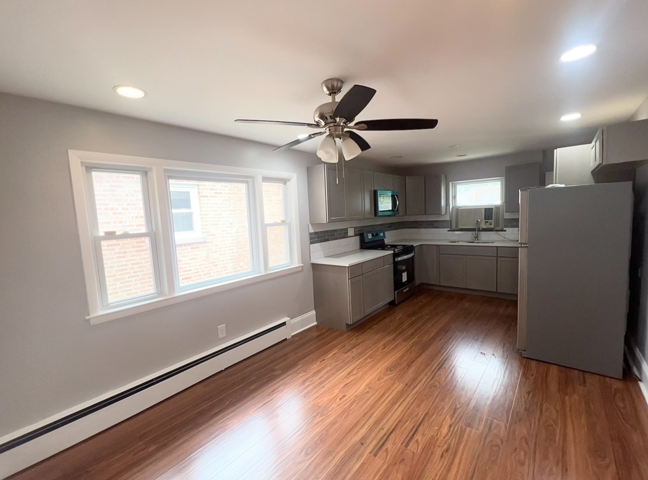 12351 South Union Avenue Chicago, IL 60628 - Photo 4 of 16 a kitchen with stainless steel appliances a stove a refrigerator and a sink
