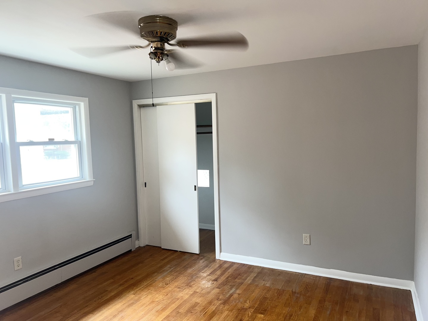 12351 South Union Avenue Chicago, IL 60628 - Photo 8 of 16 a view of a room with a window and a ceiling fan