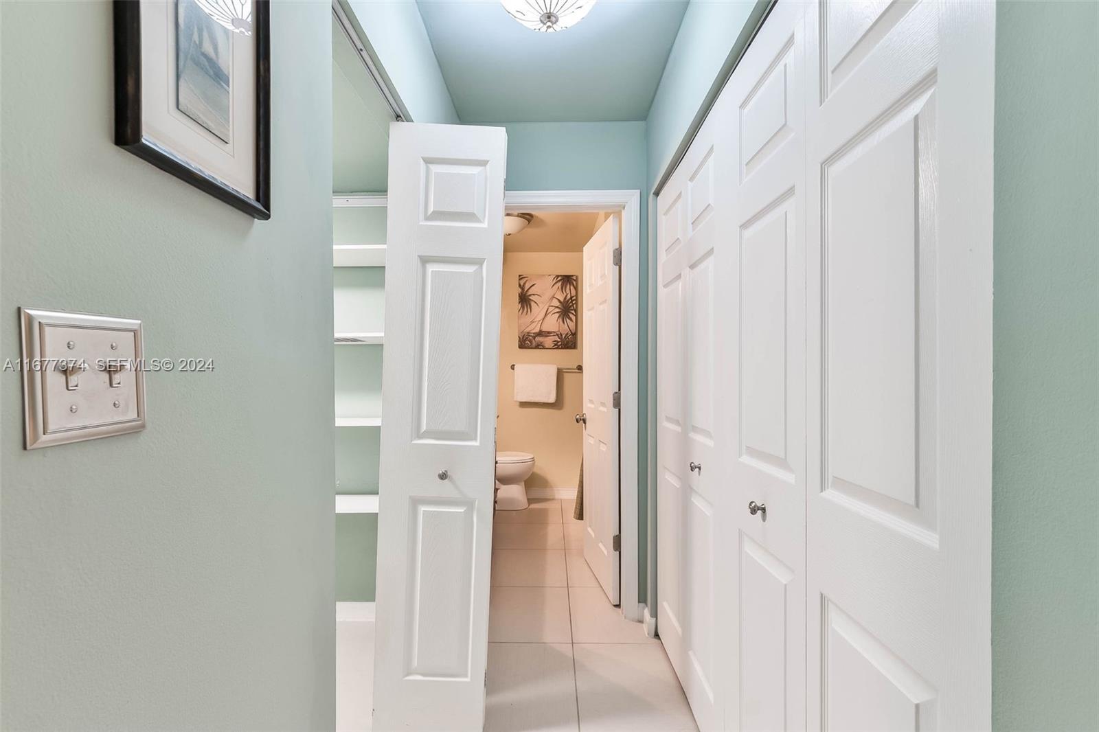 301 Racquet Club Road, Unit 108 Weston, FL 33326 - Photo 18 of 30 a view of a hallway with wooden floor and entryway