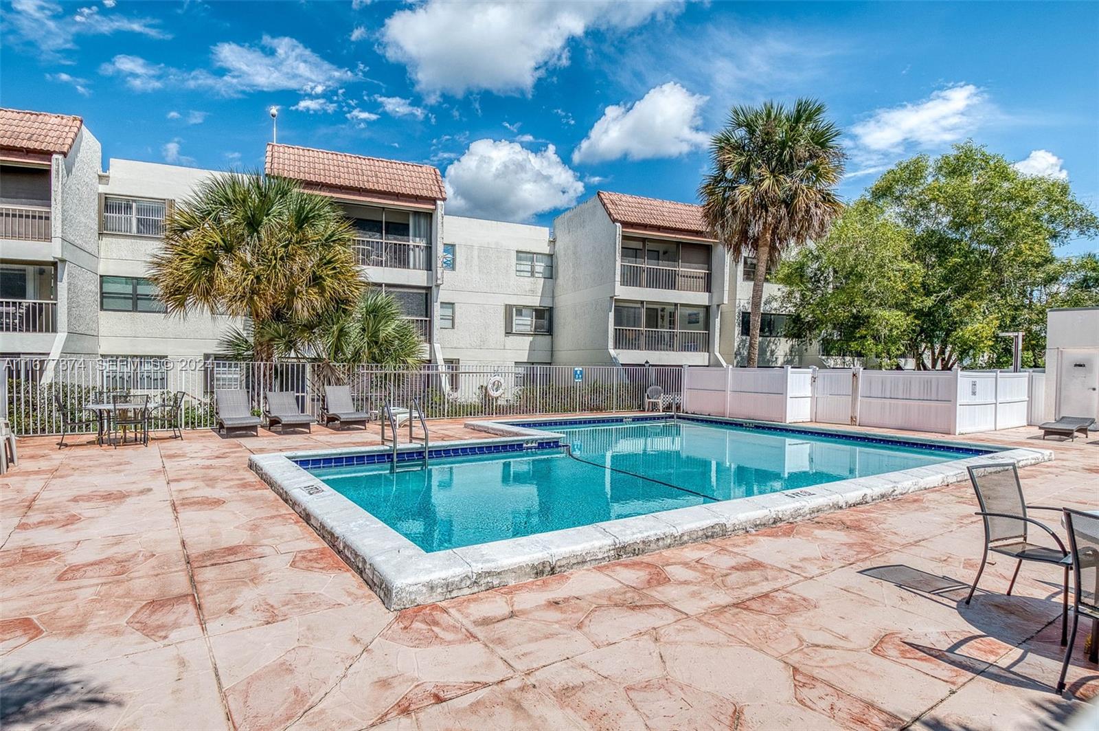 301 Racquet Club Road, Unit 108 Weston, FL 33326 - Photo 24 of 30 a view of a house with swimming pool