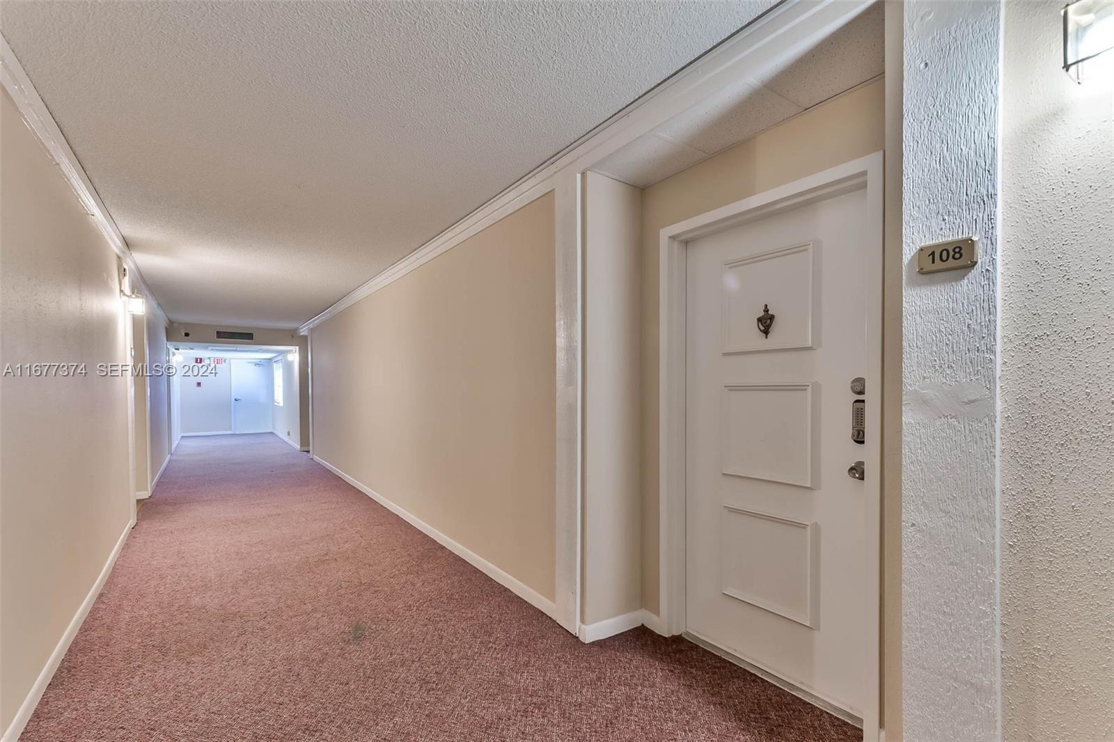 301 Racquet Club Road, Unit 108 Weston, FL 33326 - Photo 26 of 30 a view of a hallway