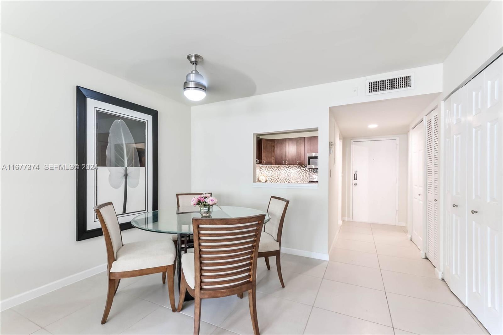 301 Racquet Club Road, Unit 108 Weston, FL 33326 - Photo 10 of 30 a dining room with furniture and window