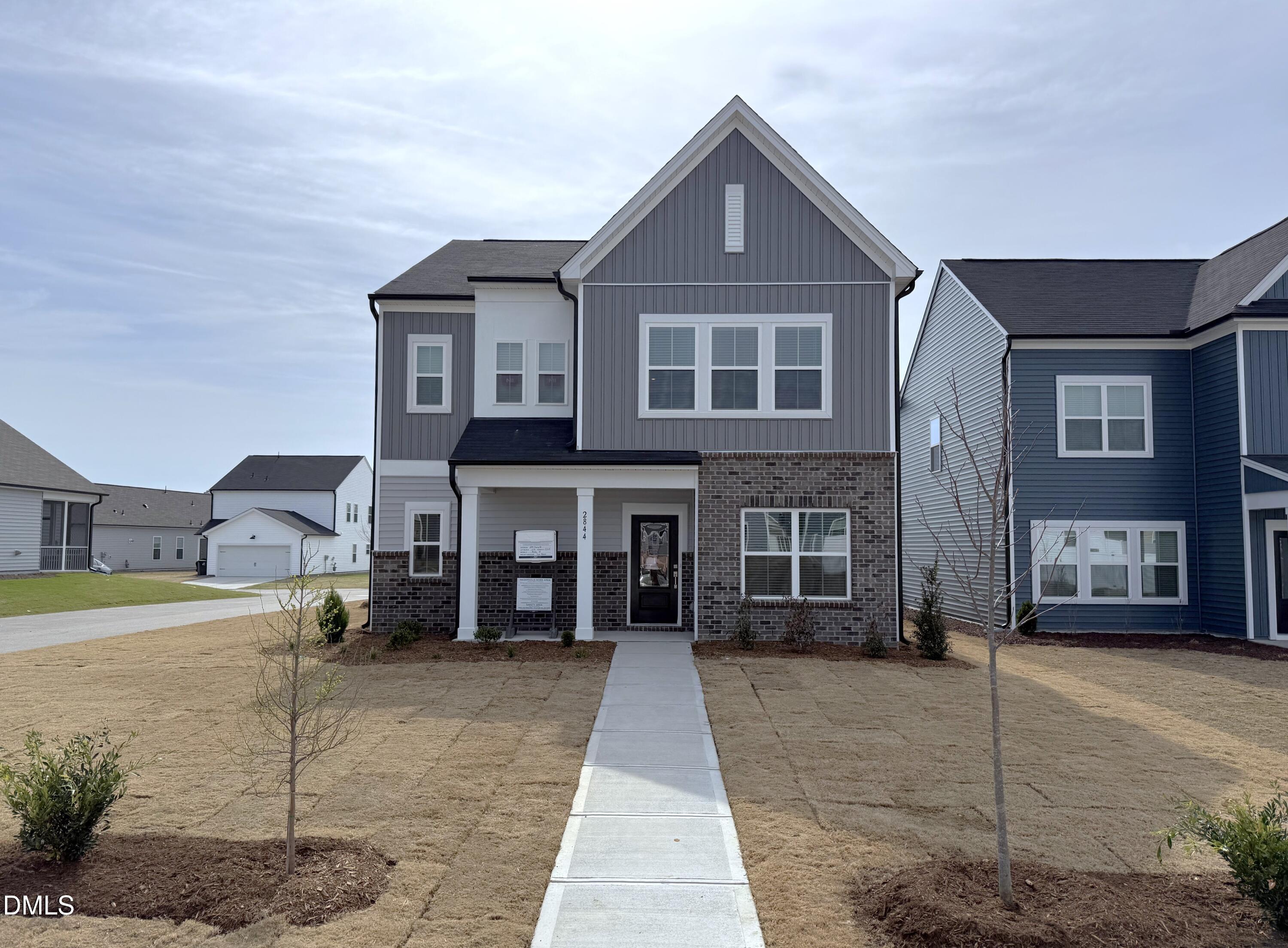 2844 Quarry Road, Unit 173 Rolesville, NC 27571 - Photo 1 of 31 a front view of a house with a yard
