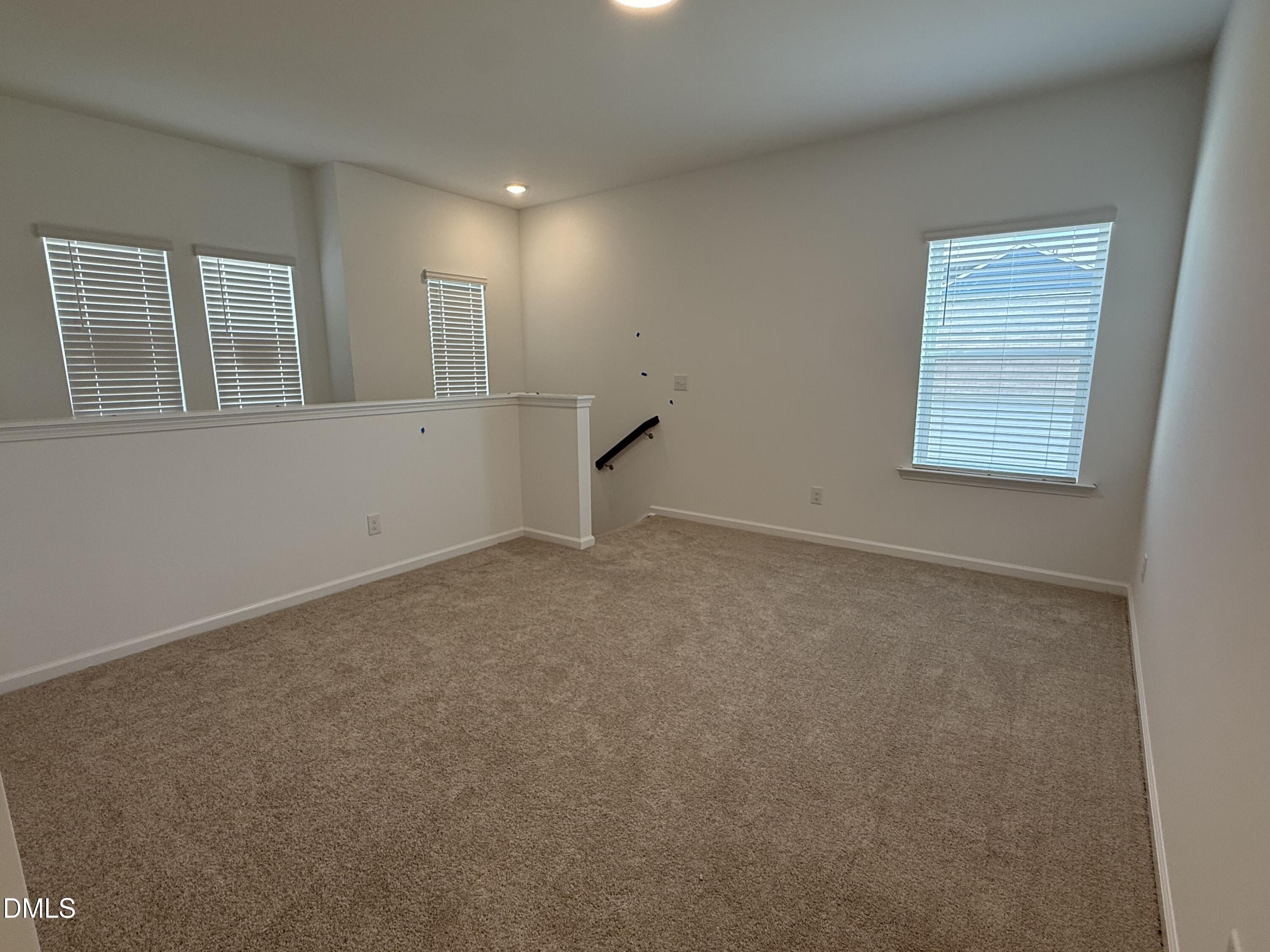 2844 Quarry Road, Unit 173 Rolesville, NC 27571 - Photo 12 of 31 a view of an empty room with a window