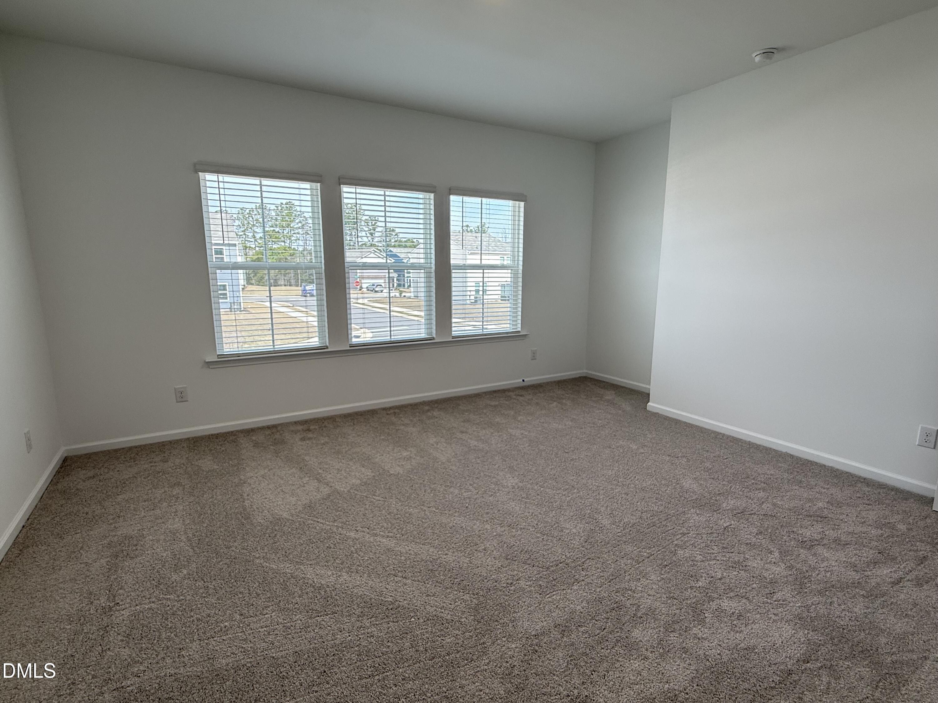 2844 Quarry Road, Unit 173 Rolesville, NC 27571 - Photo 13 of 31 an empty room with a window