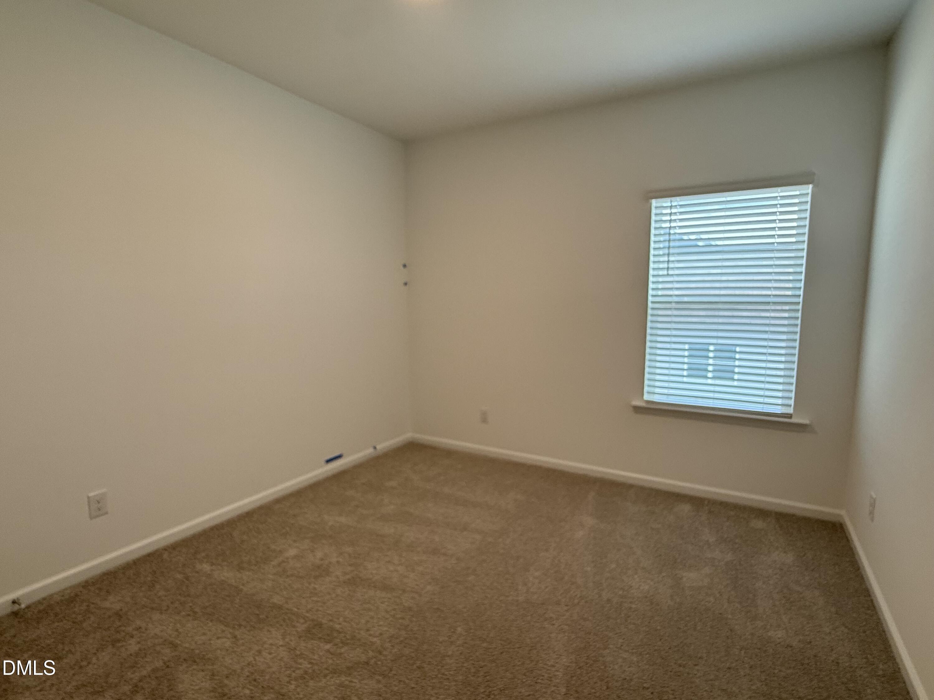 2844 Quarry Road, Unit 173 Rolesville, NC 27571 - Photo 16 of 31 an empty room with a window