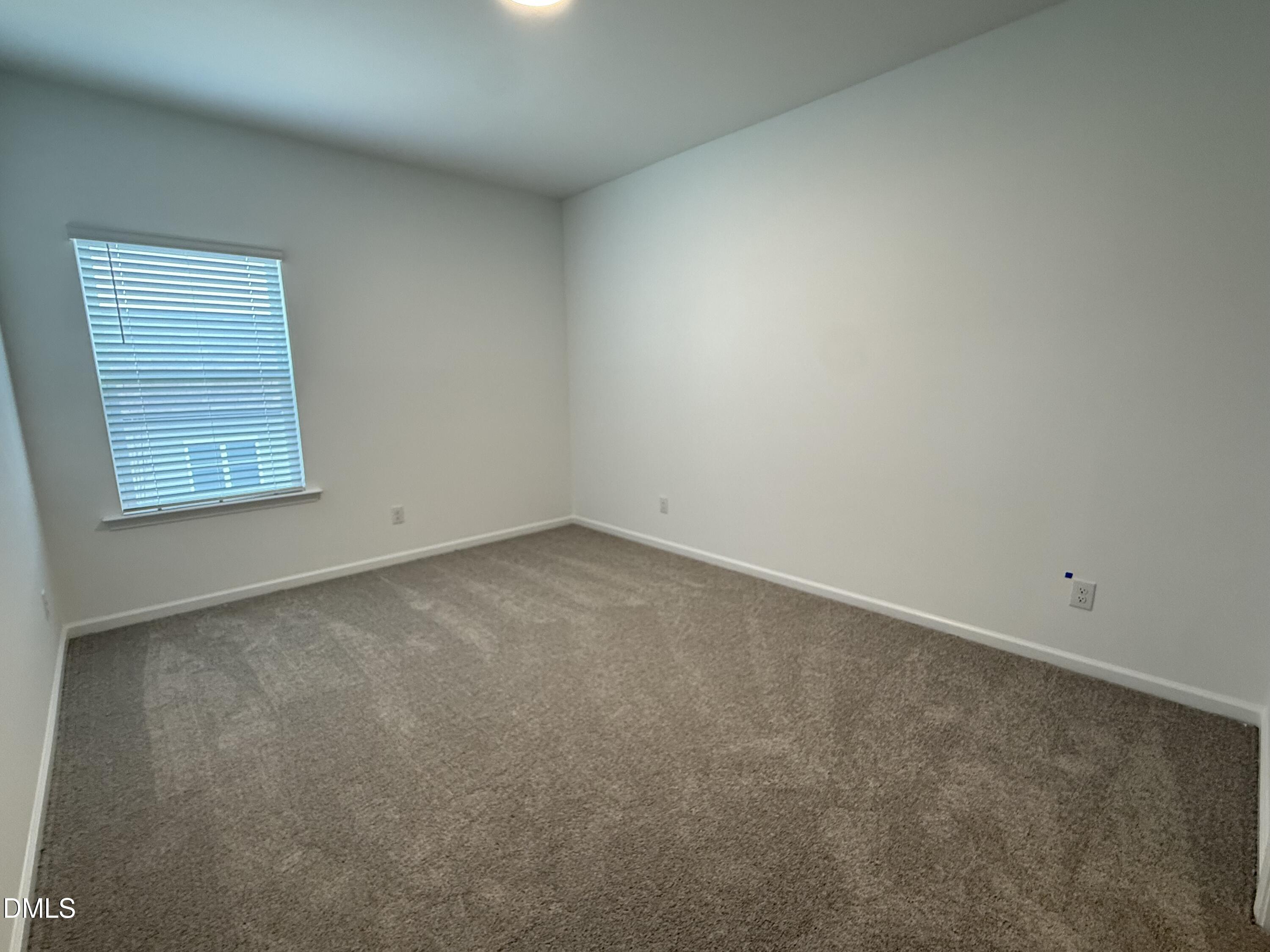 2844 Quarry Road, Unit 173 Rolesville, NC 27571 - Photo 18 of 31 an empty room with a window