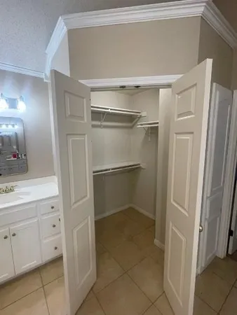 a spacious bathroom with a granite countertop sink a toilet and shower