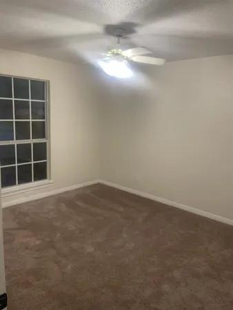 a view of bathroom with a mirror