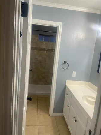a bathroom with a bath tub
