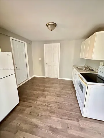 a view of kitchen and wooden floor
