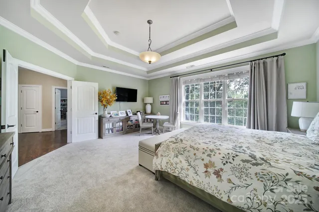 a spacious bathroom with a granite countertop tub sink and mirror