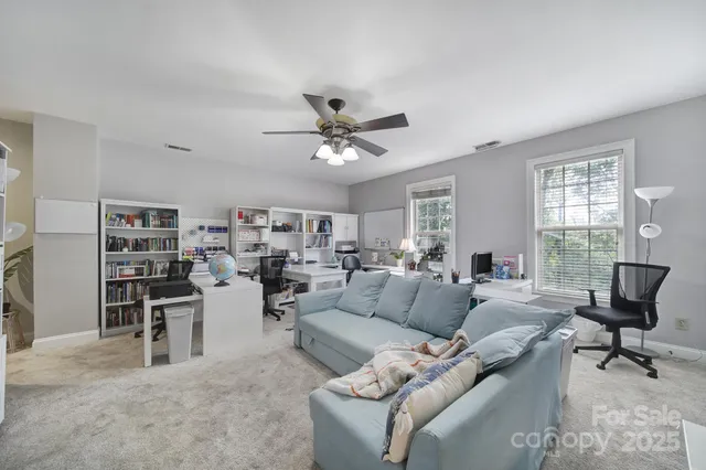 a bedroom with furniture and a chandelier
