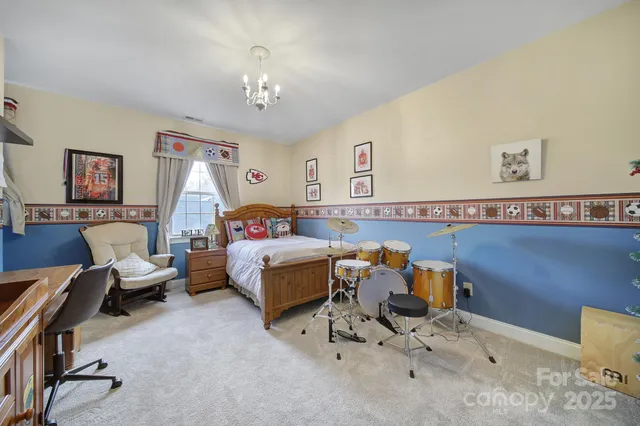 a bathroom with a granite countertop sink a mirror and a shower