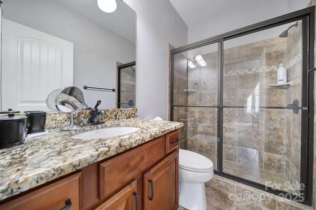 a view of a two chairs in the balcony