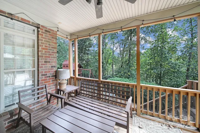 a view of a patio with table and chairs and potted plants
