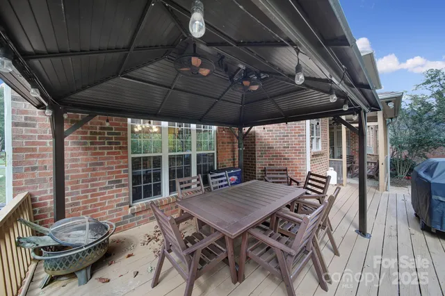 a view of a backyard with sitting area