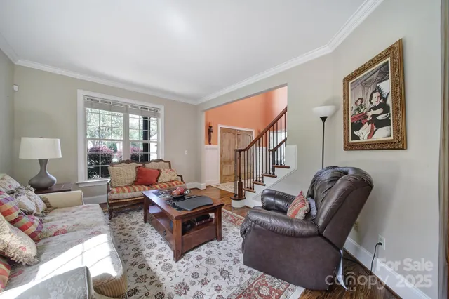 a living room with furniture rug and window