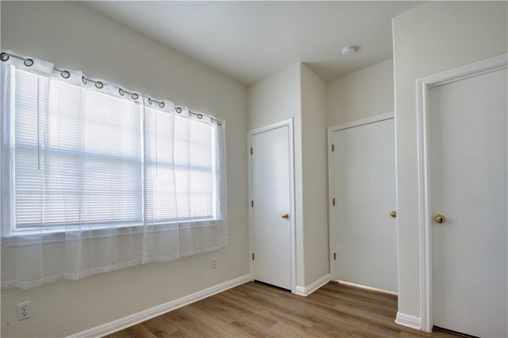 1770 County Road 329 Granger, TX 76530 - Photo 11 of 23 a view of an empty room with wooden floor and a window