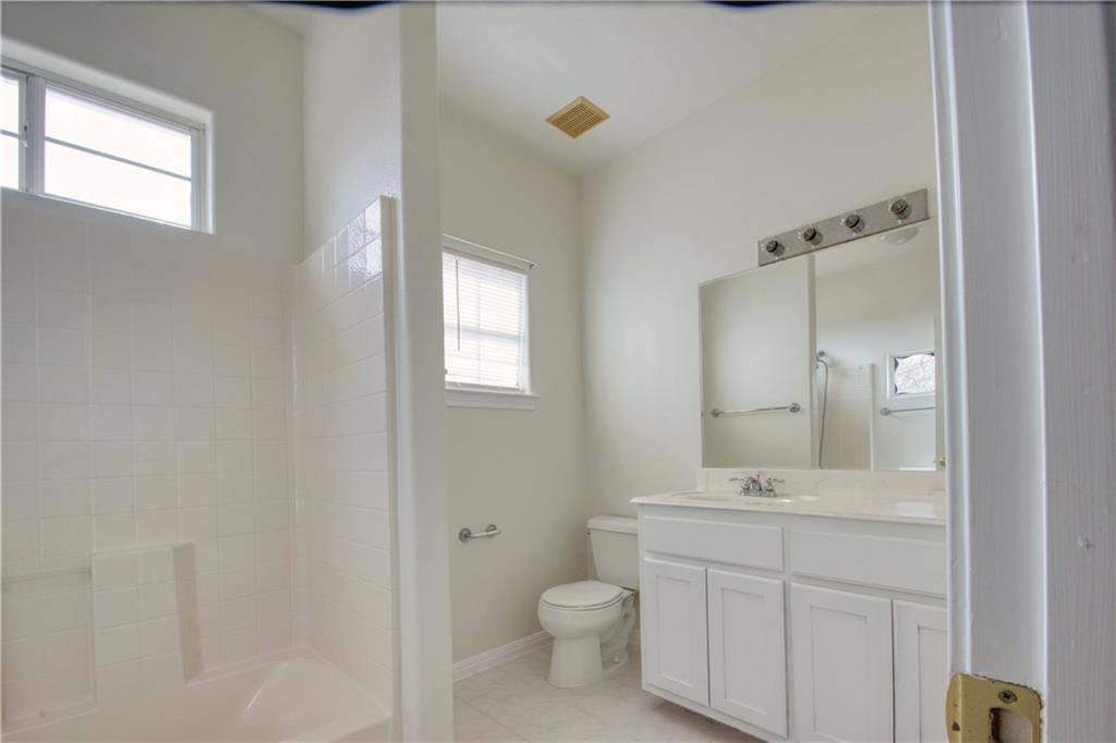 1770 County Road 329 Granger, TX 76530 - Photo 15 of 23 a bathroom with a toilet sink and mirror