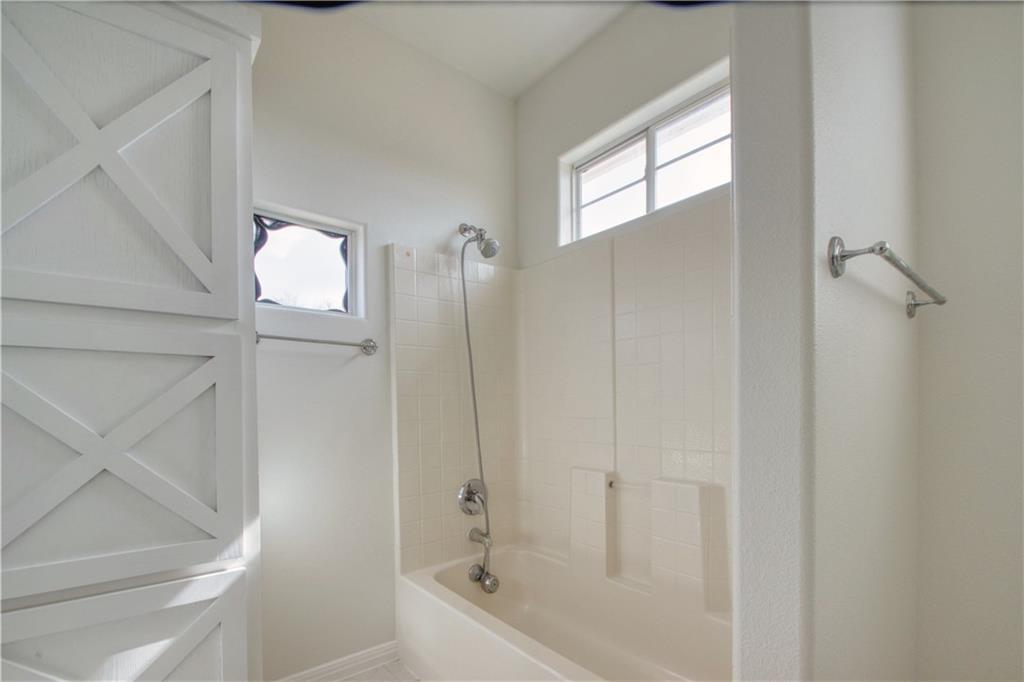 1770 County Road 329 Granger, TX 76530 - Photo 16 of 23 a bathroom with a bathtub and shower