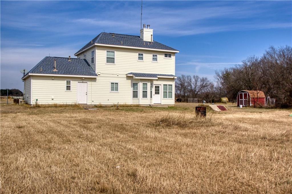 1770 County Road 329 Granger, TX 76530 - Photo 18 of 23 a front view of a house with a yard