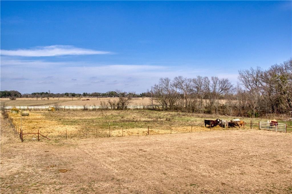 1770 County Road 329 Granger, TX 76530 - Photo 19 of 23 a view of a lake with houses in the back
