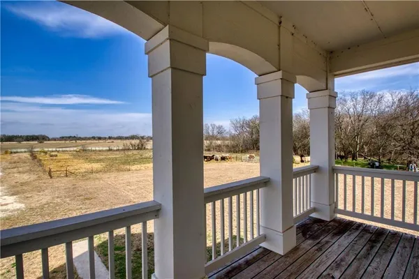a view of a glass door with wooden floor and outdoor space