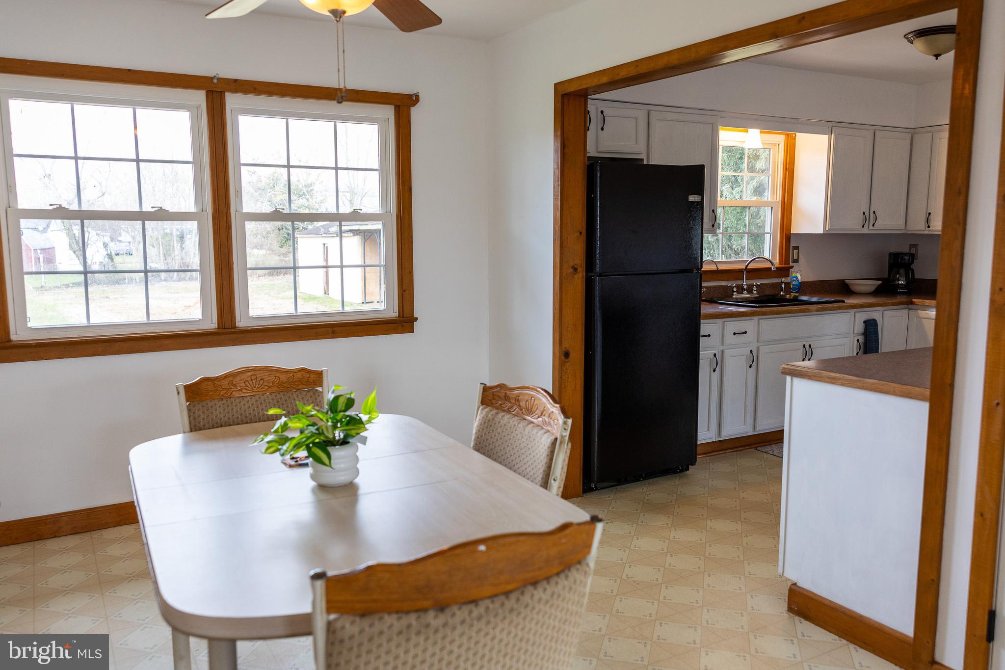 118 Grandview Drive Bridgeton, NJ 08302 - Photo 11 of 46 a kitchen with a refrigerator and a table