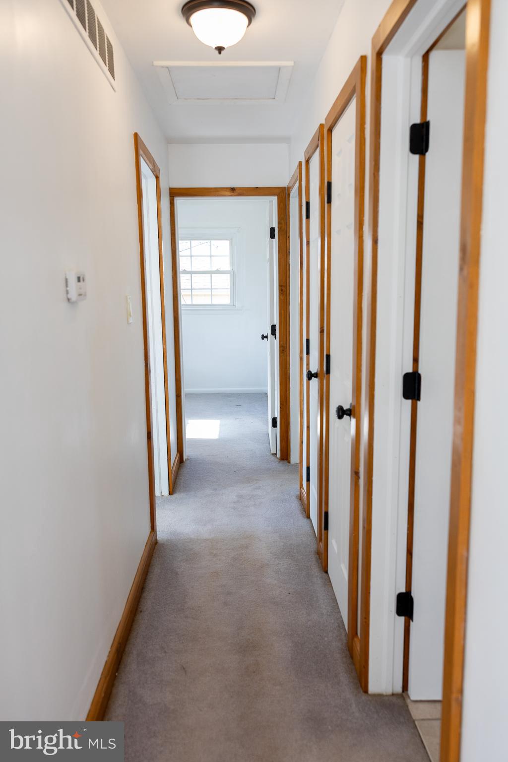 118 Grandview Drive Bridgeton, NJ 08302 - Photo 16 of 46 a view of a hallway with wooden shelves