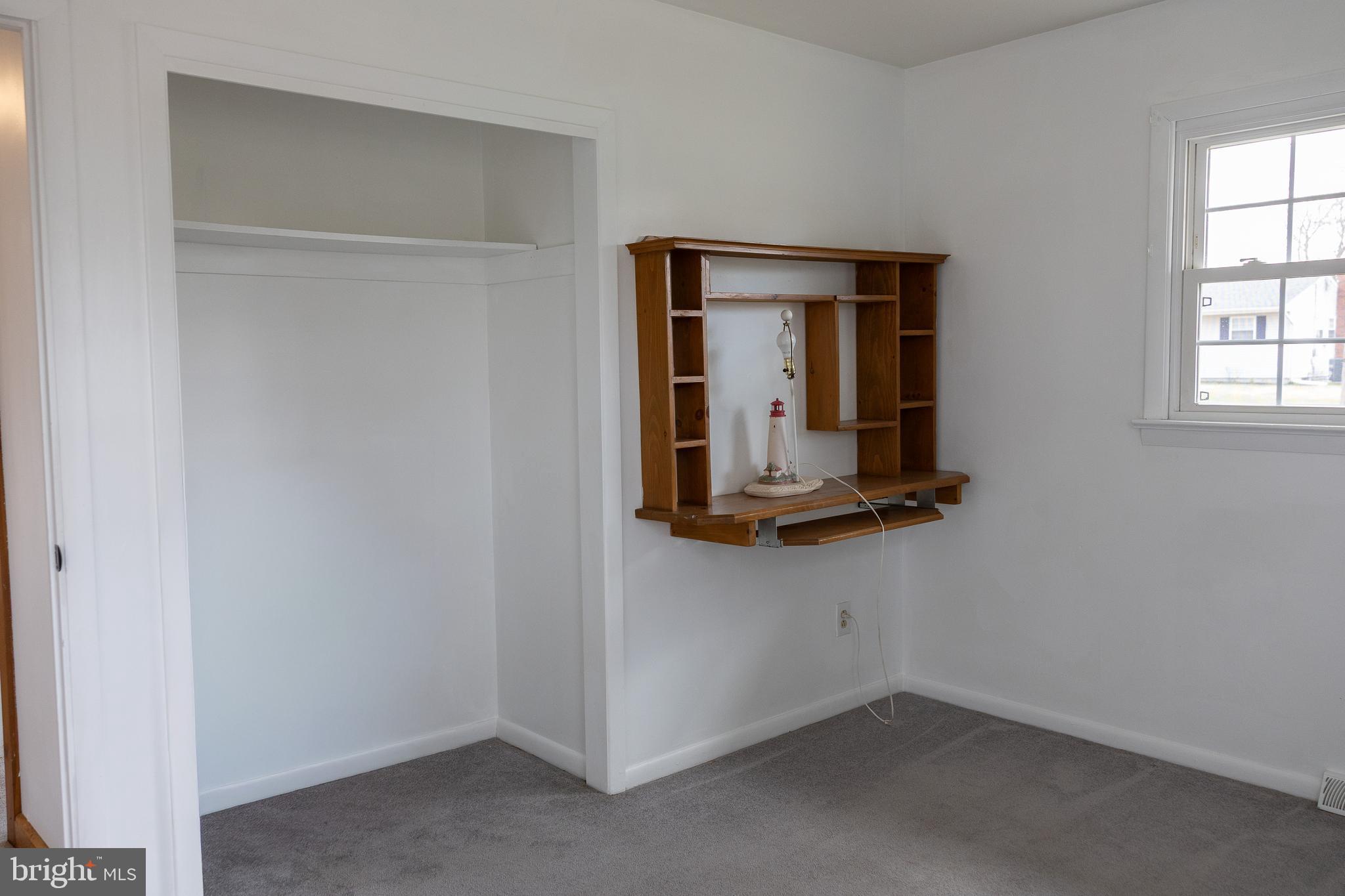 118 Grandview Drive Bridgeton, NJ 08302 - Photo 17 of 46 an empty room with wooden floor and a window