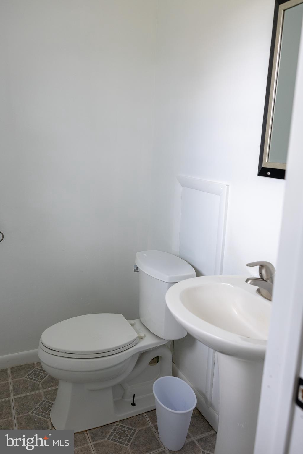 118 Grandview Drive Bridgeton, NJ 08302 - Photo 20 of 46 a white toilet sitting next to a bathroom sink